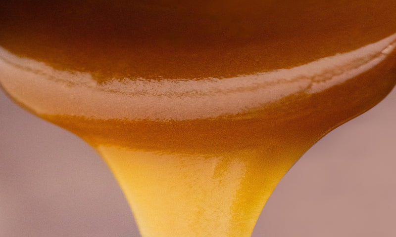 Manuka Honey being poured