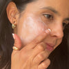 Applying a high SPF Day Cream to your face